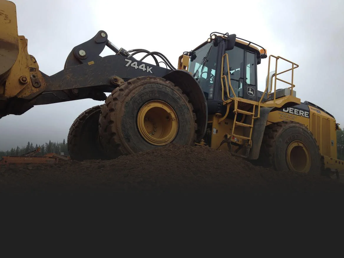 Heavy equipment operating on an earthworks site