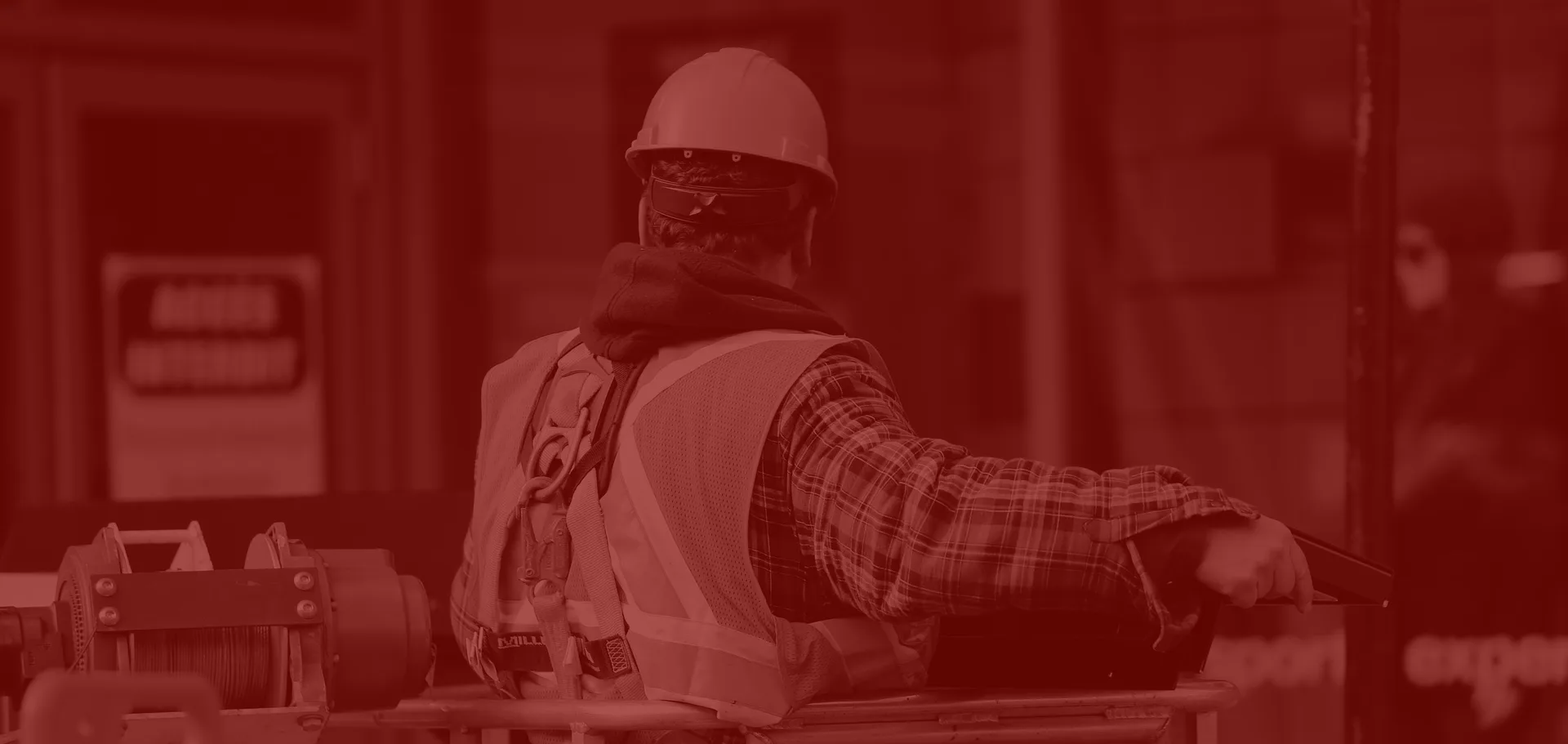 Construction worker reviewing work at an industrial site